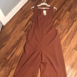 Rust colored jumpsuit with front zipper